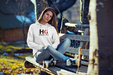 Load image into Gallery viewer, The Hübsch HG Tee is soft and lightweight, with the right amount of stretch. It has a bold HG Logo on the front in Black and Red.
