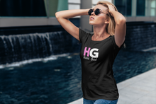 Load image into Gallery viewer, The Hübsch HG Tee is soft and lightweight, with the right amount of stretch. It has a bold HG Logo on the front in Pink and White.
